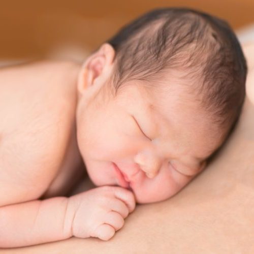 Newborn baby sleeping skin to skin